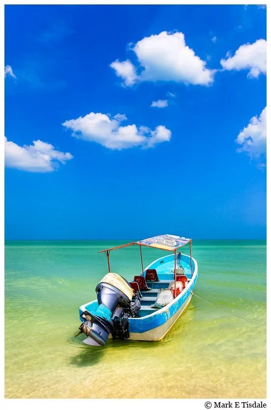 Picture of a little boat in the beautiful waters of the Gulf of Mexico in Celestún Yucatan