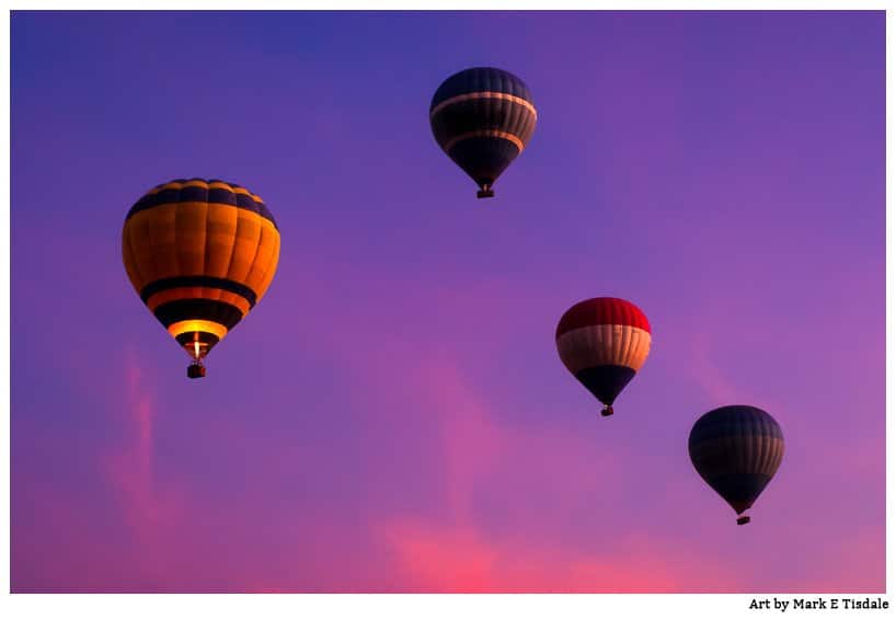Beautiful violet skies frame this picture of Luxor Hot Air Ballons