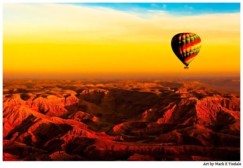 Photo - warm gold sunset in the skies over Valley of the Kings in Luxor Egypt