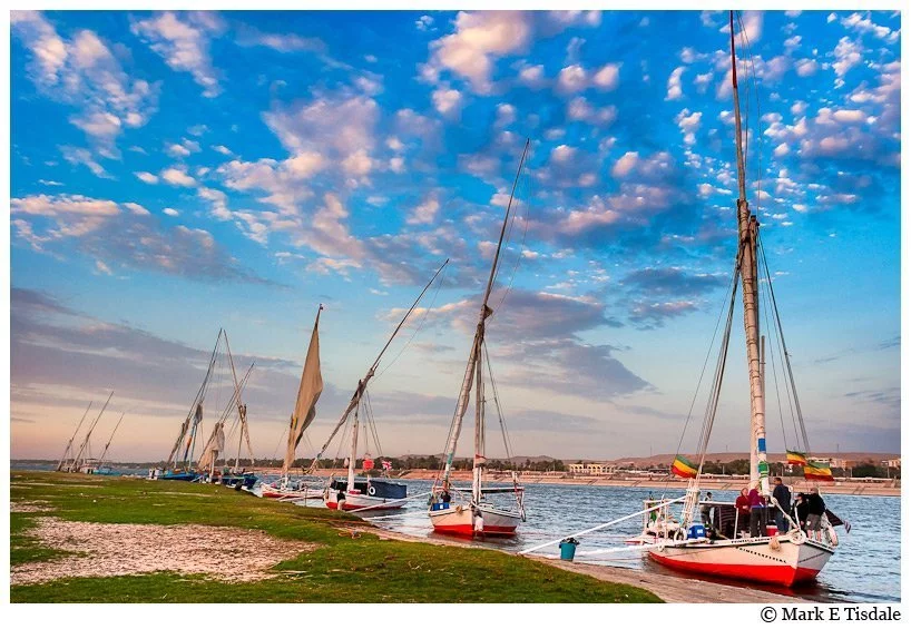 Nile in late afternoon - picture of Egyptian Feluccas beached on the river bank