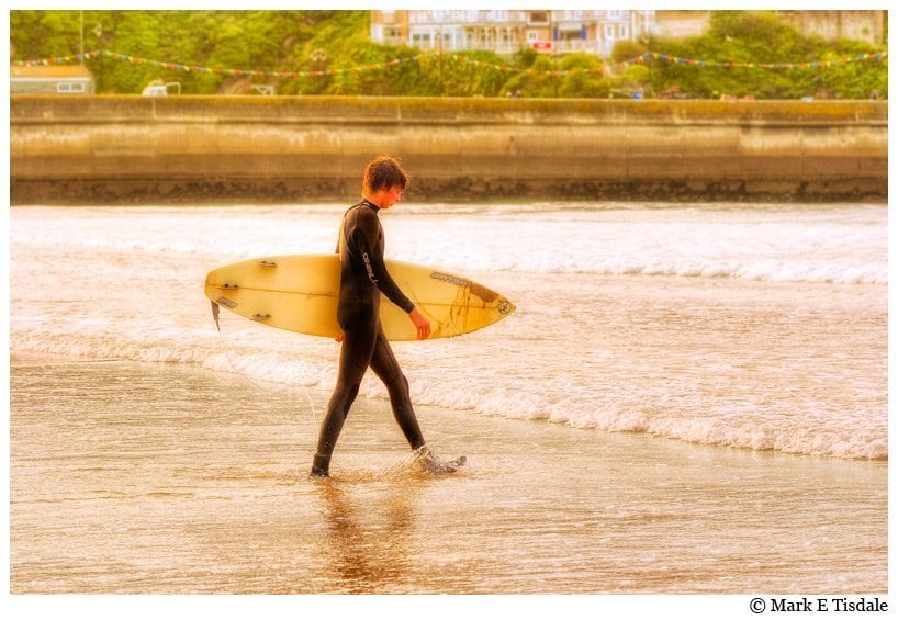 Cornwall Photo - Surfer heading out into the waters of Newquay