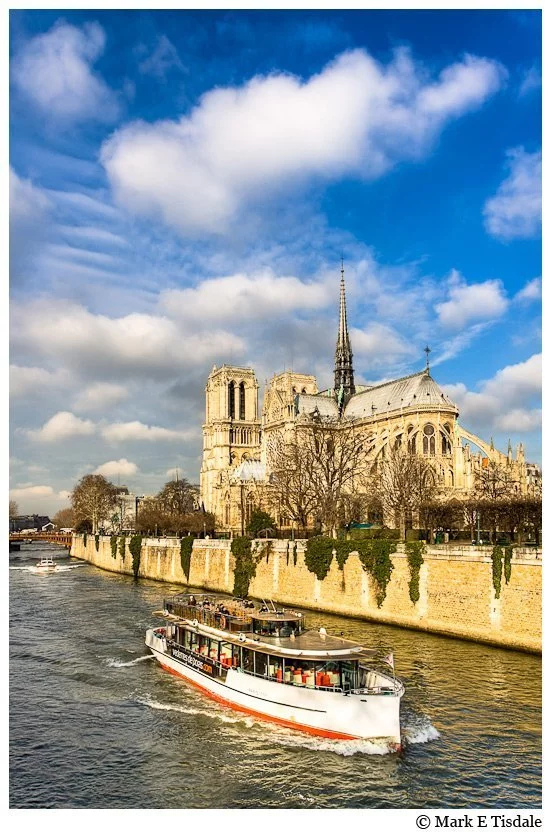 River Seine boats photo withe the Notre Dame de Paris Cathedral in the background