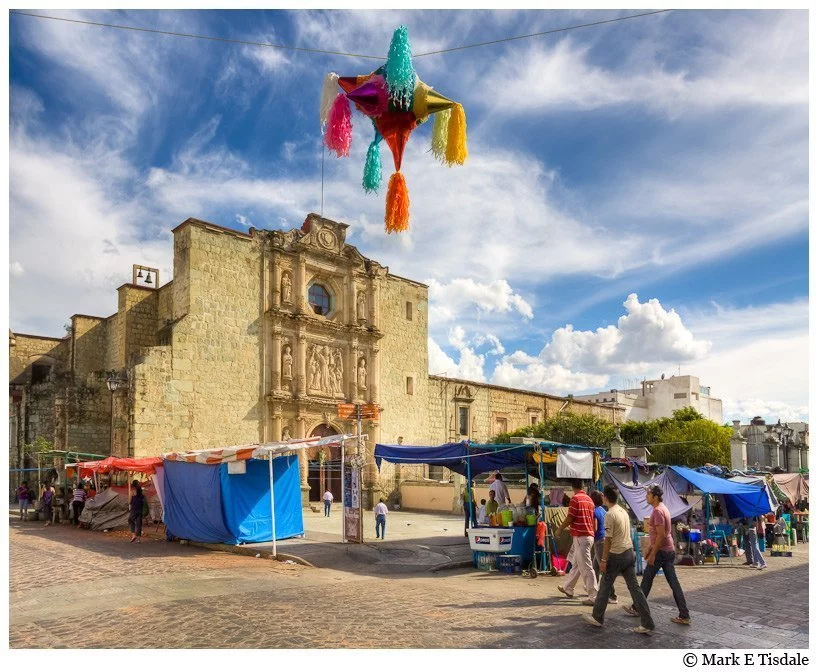 Picture of a market in front of a colonial church in Oaxaca Mexico