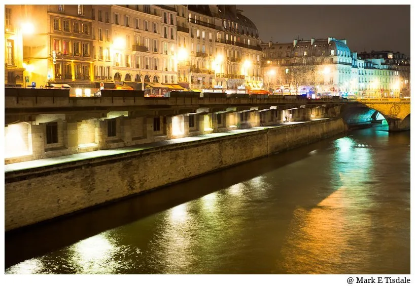 Night time photo overlooking the Seine in the heart of Paris Parisian Picture of the Seine at night and the buildings overlooking the river