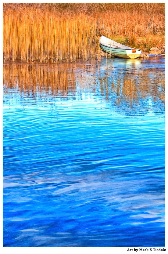 Photo of a rowboat on banks of the Corrib in Galway Ireland in the winter
