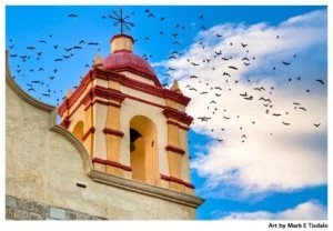 Birds in flight behind a beautiful bell tower on a church in Oaxaca Mexico - Print by Mark Tisdale