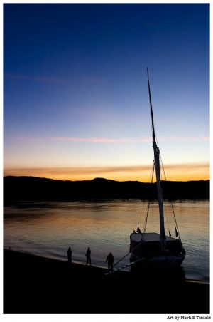 Dawn On The River Nile With an Egyptian Felucca in Silhouette - Print by Mark Tisdale