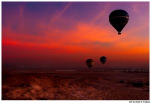 Hot Air Balloons In Flight at Dawn Over The Valley Of the Kings in Egypt - Print by Mark Tisdale