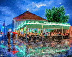 Cafe du Monde art print featuring a charming rainy Night scene in the French Quarter