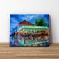 Context view of Cafe Du Monde - New Orleans In The Rain Canvas Print